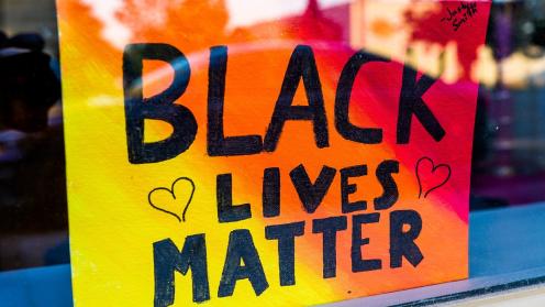 Black Lives Matter poster in window of downtown business.